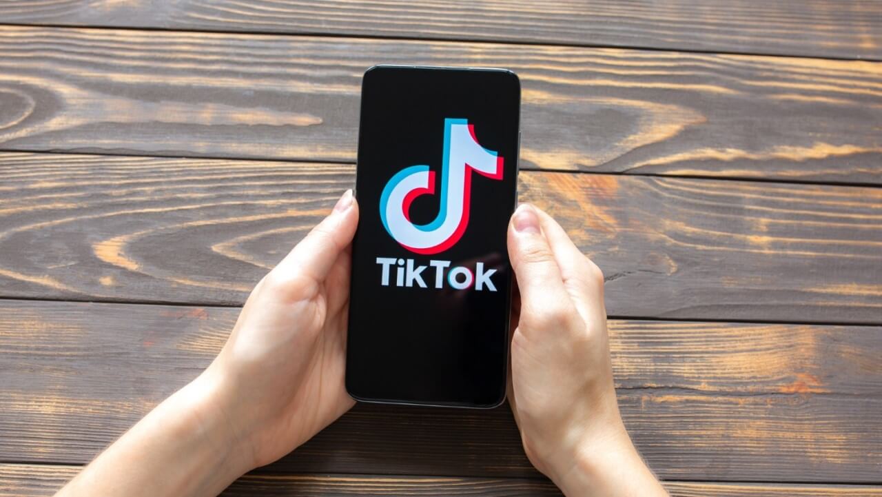 tiktok-logo-smartphone-with-hands