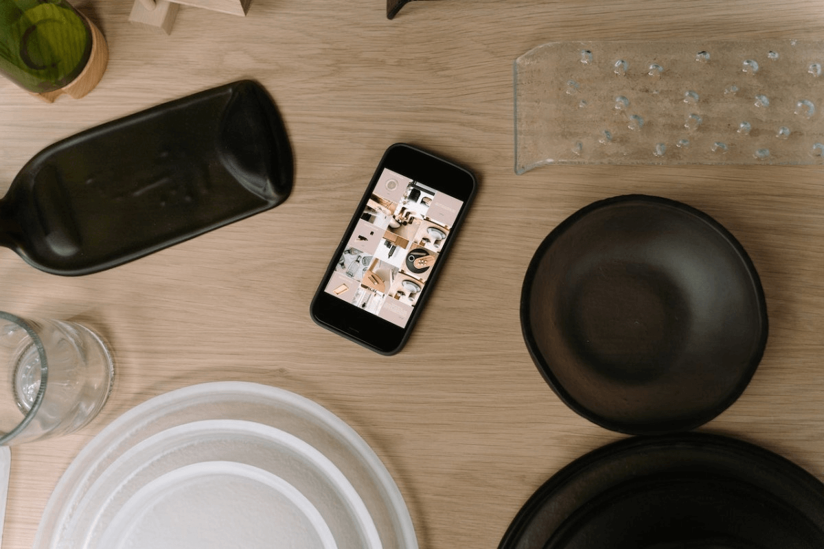 black-tableware-and-smartphone
