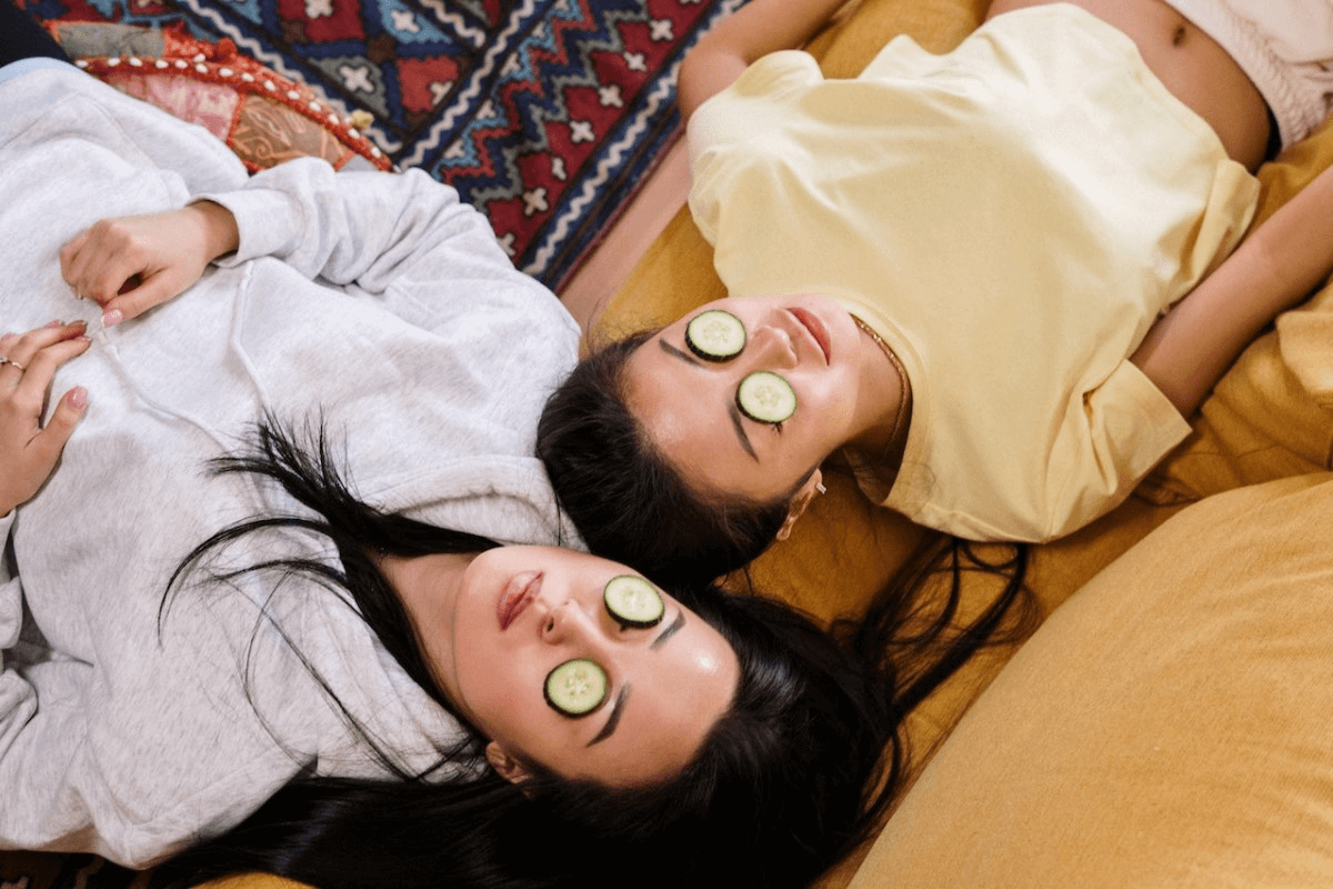 two-women-with-cucumbers-on-their-eyes
